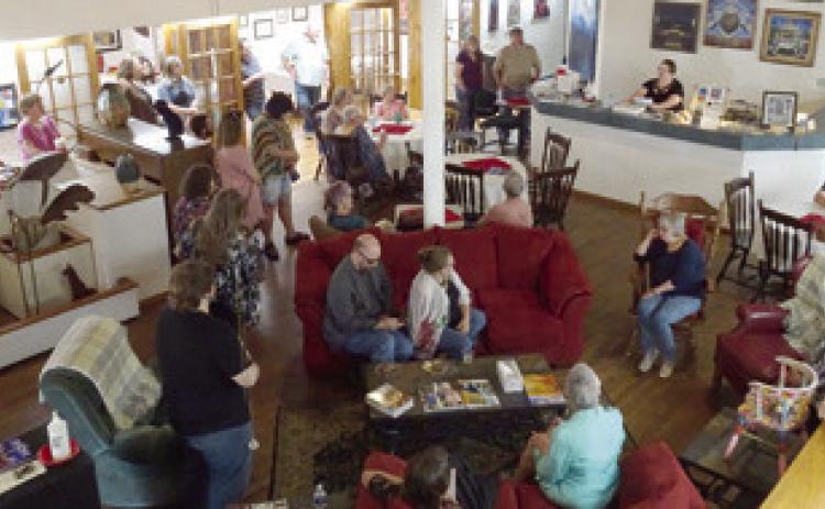 A large crowd turned out for the new art show at Maple Uncommon Sunday. The show features artists from the Joplin Regional Art Coalition and will be on display through July. Photo by Sara Comer.