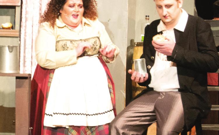 Cherokee County Arts’ latest musical, “Sweeney Todd,” is running tonight and tomorrow night at 7:30 in the James R. Christman Performing Arts Center in Galena High School. The title character, Sweeney Todd (Chris Tanksley), admires one of Mrs. Lovett’s (Kimberly Arzoian) famous meat pies early in the first act. Photo by Jacob Spencer.