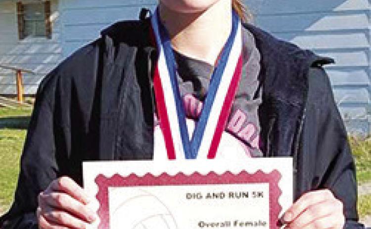 Katelyn Draeger won first place in the Lady Titan Volleyball Fundraiser 5K Run, April 20. Katelyn took first in the 14-18 age group and was the overall female racer with a time of 30.43 minutes. Courtesy photo.