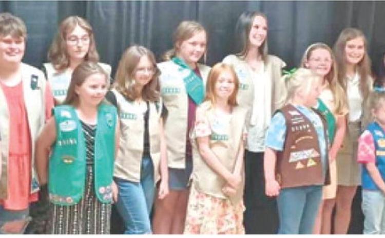 In September 2024, the Cherokee County Girl Scouts held a Bridging and Awards banquet honoring both girl scouts and adult volunteers. Girls Scouts from five Cherokee County Troops bridged up to the next level in Girl Scouts. Izabel Manus from Troop 70363 (third from left) received her Silver Award for her project of building a fire pit area at the Columbus Scout House. Courtesy photo.