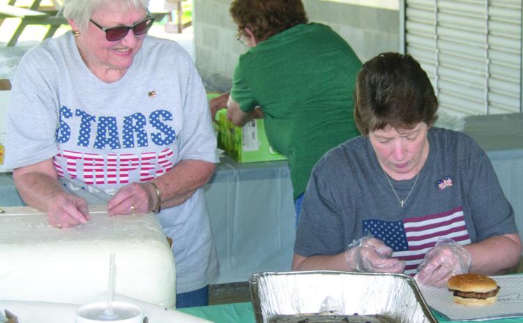 Linda Garrison and Linda Griffitt were wrapping burgers for the recent veterans and first responder appreciation lunch.