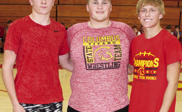 Senior members of the Titan Wrestling Team were introduced during the Meet the Titans Night at the Columbus Unified High School Gymnasium, November 28. Kayden Cox, Jake Eddington, and Cade Saporito.
