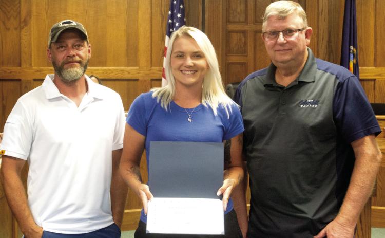 A certificate was presented to Kasie England by City Superintendent Randy Coble and Mayor Grant Spieth recognizing her five years working in the Public Works Department of the City of Columbus. The presentation was made during the City Council meeting on Monday evening.
