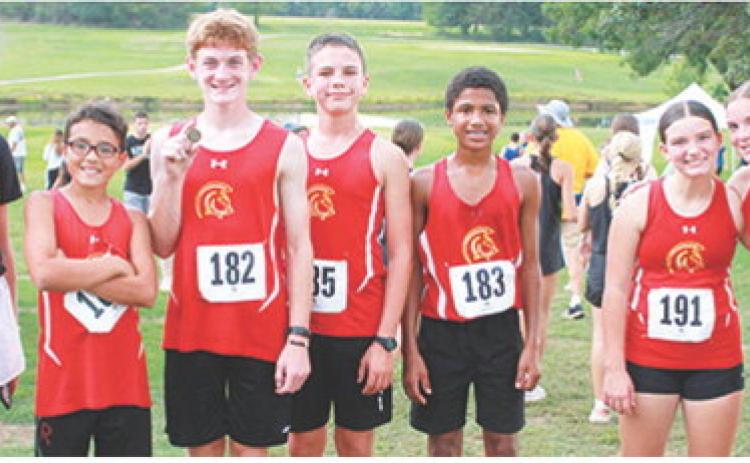 Members of the Columbus Junior High School Cross Country Team display the medals they won at their home meet, Tuesday, at Brush Creek Golf Course. Lydan Atkinson won the eighth boys race and Lyndee Smiley placed fourth in the eighth grade girls race. Carrie Engroff is the coach for the CJHS team. Kross Davis, Lydan Atkinson, Trevor Lacen, Kai Davis, Alaina Smiley, and Lyndee Smiley were present for the photo.