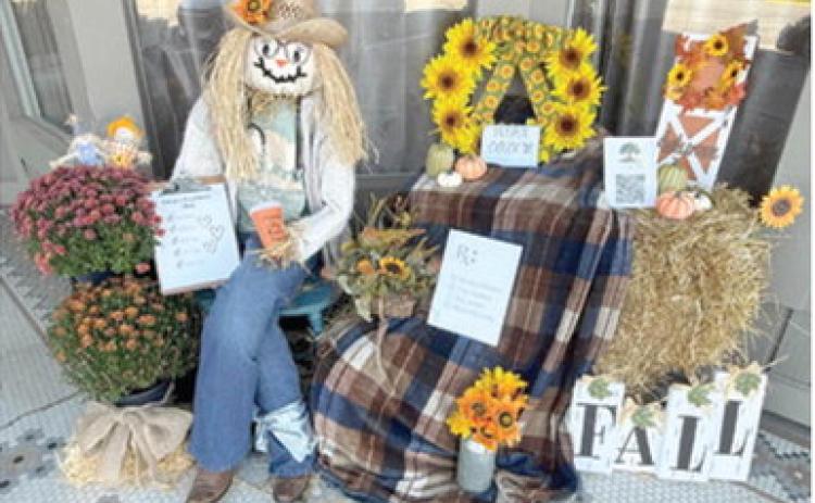 Winners of the annual Columbus Day Scarecrow contest have been announced. First place was awarded to Acorns to Oaks. They created this festive fall scene in front of The Maple District. Courtesy photo.