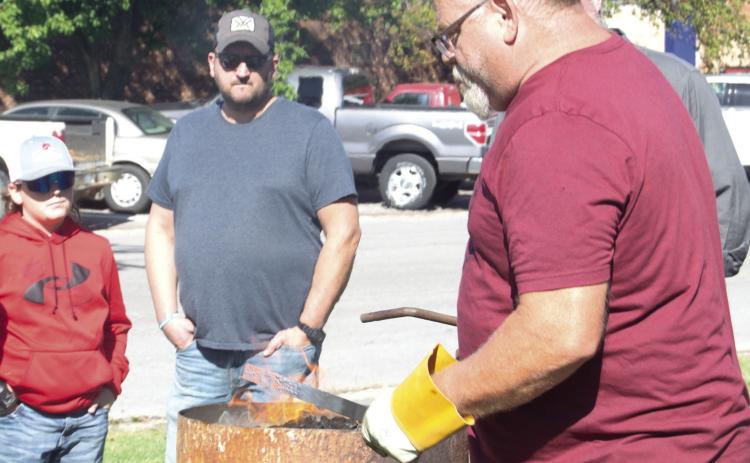 There was a lot of interest in watching Knife Smith Phil Evans ply his trade at the forge. During the recent Columbus Days Festival Evans worked on the front lawn of the Columbus Museum where visitors watched him develop a new knife.