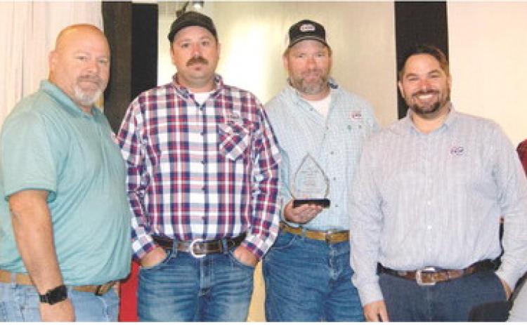 Farmers Coop employees Paul Evans, Jeff Karsten, Trevor Brown and Coop Manager Matt Case accepted the Business Growth Award at the Economic Development Breakfast Wednesday.
