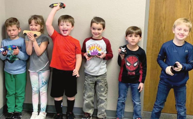 Cub Scout Pack 15 recently held their annual Pinewood Derby. Racers included Ben Garrett, Amelia Garrett, JD Anderson, Amos Plank, Christian Kress and William Kress. Not pictured : Kason Pitts and Kenny Russell and Cub Scout Master Jared Plank. Photo by Dee Riley.