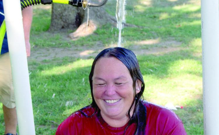 Highland Elementary teacher Bekah Noel spent time in the modern-day dunking booth. When the student hit the target the water streamed out of the bucket above her head.