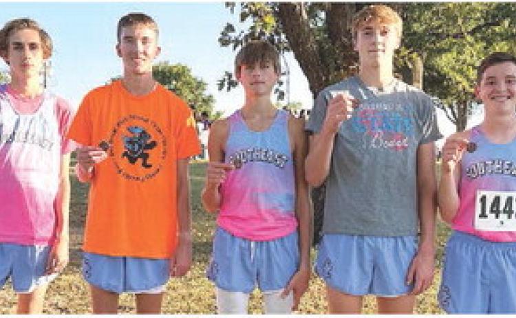 The Southeast Lancer Boys Cross Country took top honors at the Columbus Invitational Meet, Tuesday, at the Brush Creek Golf Course. Zack Whittenburg, Ryan Sossmanm, Henry Burns, Tucker Sutton, Zayne Gabern, Hudson Locke, and Michael Smith scored 52 team points, to beat Pittsburg, 57, for first. Courtesy photo.