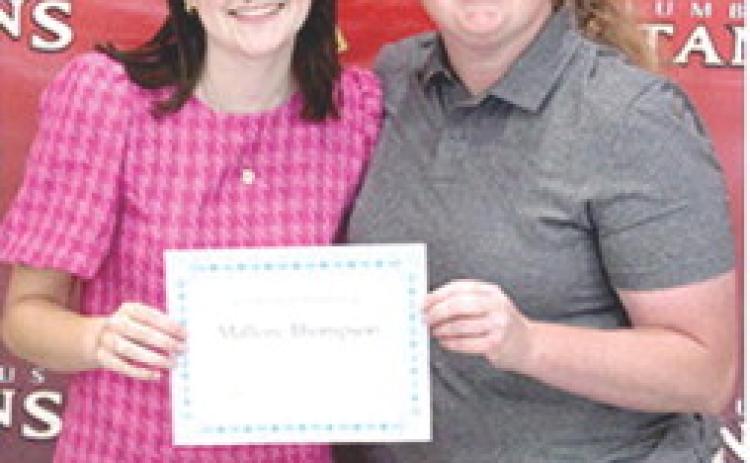 Mallory Thompson received the Student Council Scholarship for $500 from Columbus High School StuCo Sponsor, Christine Lovell, during the 2025 Senior Assembly, May 16, at the CUHS Gymnasium.
