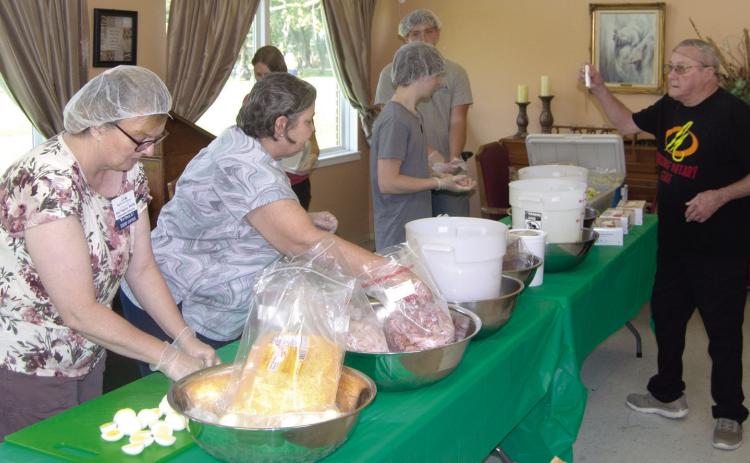Employees of Medicalodges were busy making salads on Wednesday morning as a fund raiser. The money will be used to take residents on a field trip. In the past they have gone to several shows in Branson