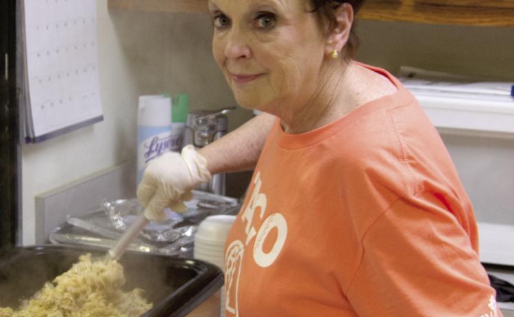 Ann Thiele stirs the chicken for the soft taco lunch fundraiser held by Columbus Mercy Auxiliary Friday, May 5.