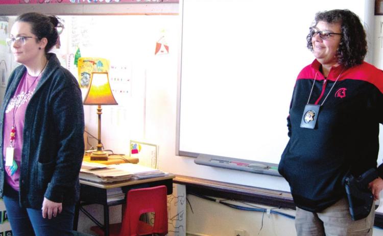 School Counselor Alison Wilkins (left) and School Resource Officer Anne Sharp (right) brief Highland Elementary third grade teacher Bekah Hutto’s class on the ALICE program last week. Students were briefed on what steps to take in the event of an armed intruder being on campus. Photo by Jacob Spencer.