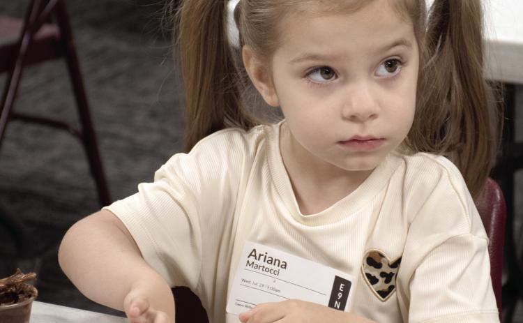 Connecting Point Church of the Nazarene recently held their first Vacation Bible School, ‘Rainforest Falls’. The theme focus for Wednesday, July 29 was “God is our safe place.” Ariana Martocci builds a cabin of graham crackers, pretzels and Nutella.