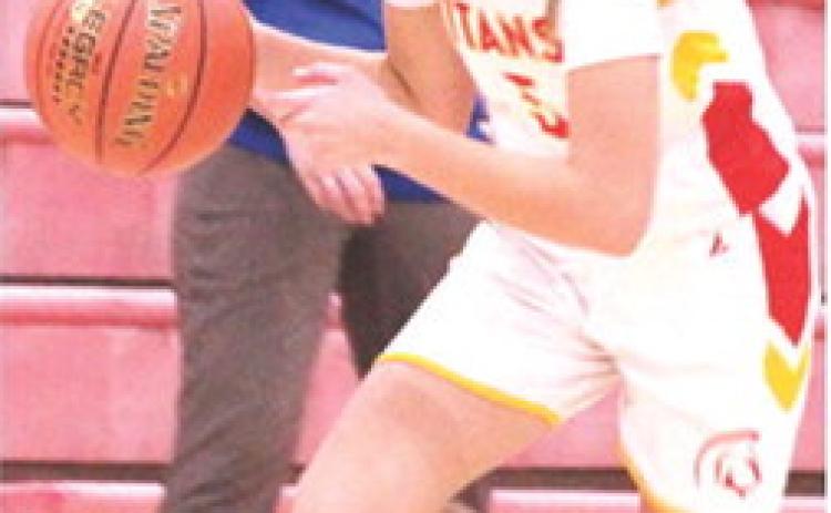 Lady Titan Eighth Grader, Kip Saporito, drives the court during a home game against St. Mary’s-Colgan, October 30. Columbus moves to the midway point of their season with games in Frontenac, today at 5:30 p.m. They will host Galena, Thursday, at 1 p.m.