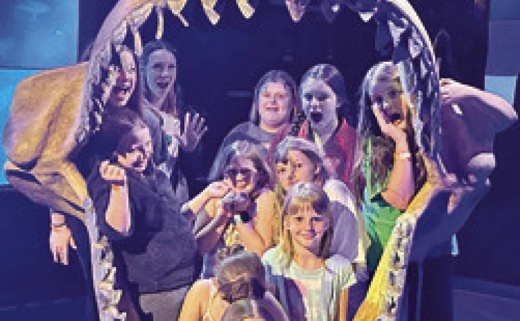 How many Girl Scouts can fit into the mouth of a shark? Quite a few judging from this exhibit at the Aquarium in Springfield, Mo. The girls used money they earned from cookie sales to take an overnight trip to the Wonders of Wildlife Aquarium. Courtesy photo.