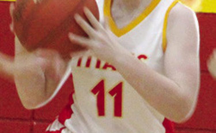 Mollie Sauerwein, Lady Titan Seventh Grader, looks to pass up-court after getting a steal in early season games at the CUHS Gymnasium.