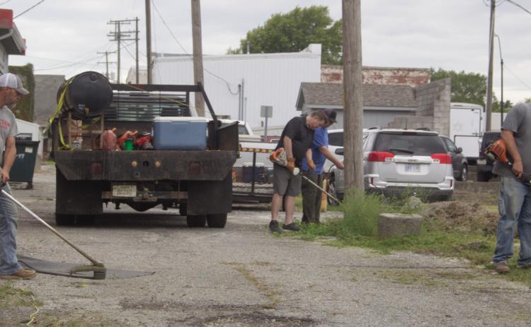 City employees were busy as part of the Imagine Columbus Service Day. The City joined in by cleaning and weeding alleys and parking lots in the city.
