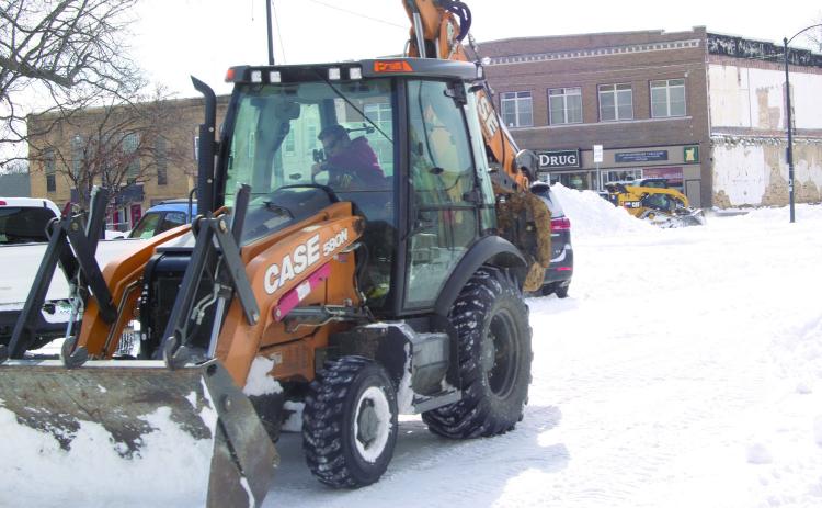 The road crews in the city had much of the snow off the roadways Wednesday. Despite the prediction of much more snow most folks think this was plenty.