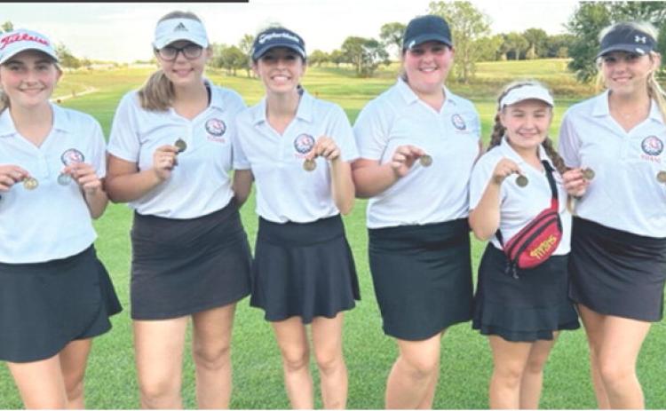 The Columbus Lady Titans and senior, Reese Grundy, earned first place at the Frontenac Invitational Golf Tournament in Erie, Tuesday. Junior, Mallory Thompson, tied Grundy in first place with 94 strokes but lost the tie breaker. The Lady Titans are nearing the end of regular season and preparing for post season tournament play. Team members are: Mallory Thompson, Anna Head, Natalie Wary, Jaiden Campbell, Amory Neely, and Reese Grundy. Courtesy Photo.