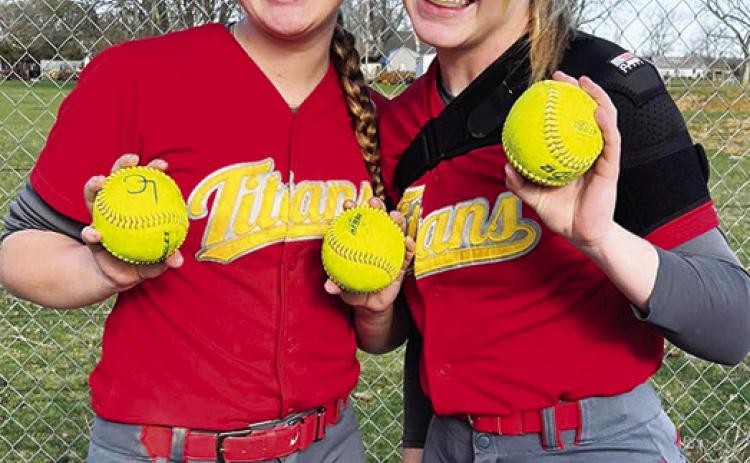 Lady Titan Juniors, Kaitlynn (KT) Lopp and Graci Major, collected their home run balls following their season opener on the road in Altamont. Lopp knocked two dingers over the fence and Major hit one over to help Columbus in their 17-1 win over the Lady Grizzlies, Monday. Courtesy Photo.