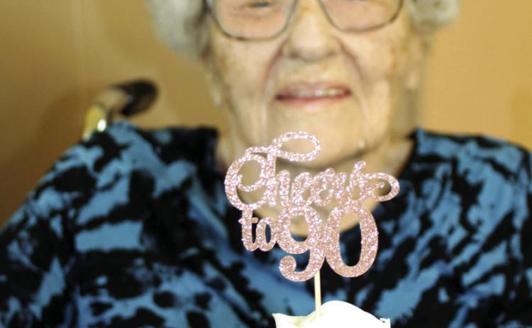 Shirley Grant shows one of the cupcakes from her 90th birthday party. Family and friends joined her in honor of the occasion.