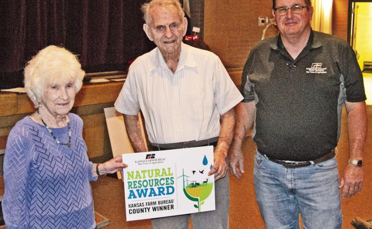 Lillian and Jim Hefley received the Natural Resources Award from Jay Evans at the recent Farm Bureau meeting.