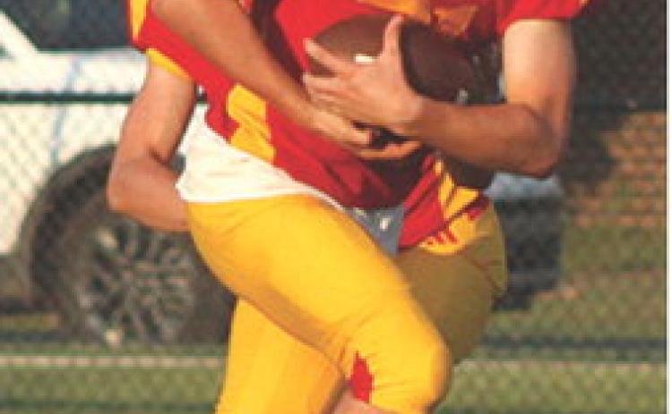 Titan Junior, Shade Schuberger, (left) had a long run inside the fiveyard line before being brought down by the Bulldog defender short of the goal line. A penalty and lost yardage kept Columbus out of the end zone during the Titan Junior Varsity loss to Galena, 0-24, Monday, at Titan Stadium.