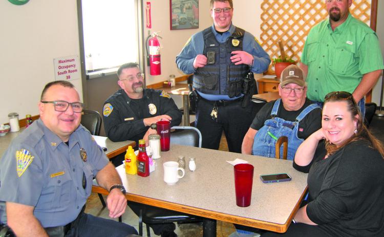 Cherokee County Sheriff Brian Henderson, Baxter Springs Police Chief Jimmy Hamilton, Assistant Baxter Springs Police Chief Corky Hicks and Community Outreach Deputy Rhanda Andrews visit with locals at a recent “Coffee With a Cop” event.