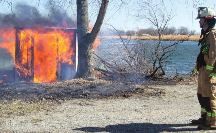 A controlled burn lit up a fiberglass boathouse