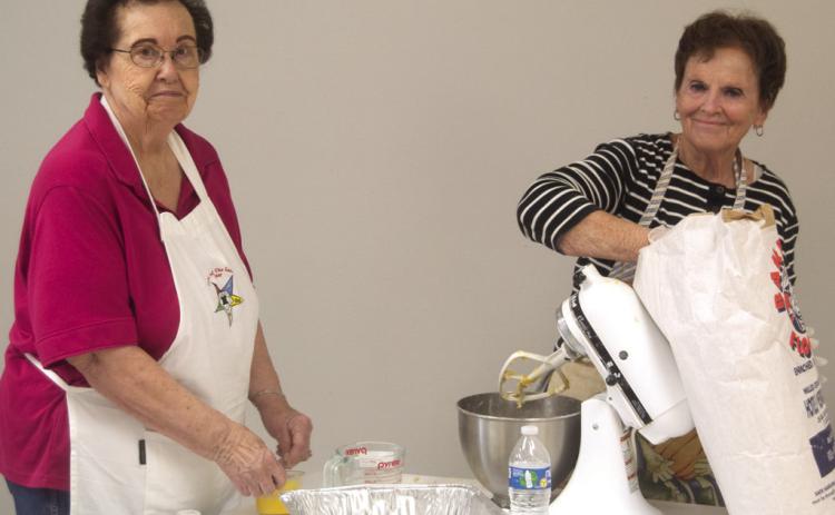 Each of the Mercy Auxiliary members had a task when they recently gathered to make noodles for a fundraiser. Ladonna Smith was rolling dough and Ann Thiele was measuring flour. Columbus News Report photo by Shawn Churchill.
