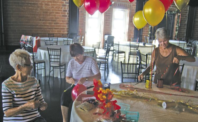 A lot of work goes into putting on the All-School Reunion. Before the dinner began, committee members showed up to inflate balloons, tie on ribbons and decorate all the tables and make sure everything was ready for the evening’s festivities.