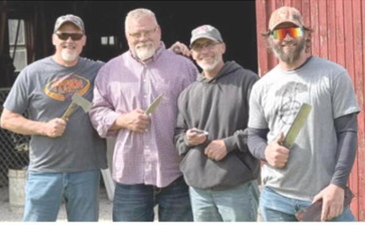 Four Columbus knife enthusiasts were prize winners at the recent Kansas Custom Knife Makers Association meeting on April 19th at the Dickinson County Heritage Center in Abilene. Todd Murdock the unofficial best ax award, Phil Evans best hunter award and best of show, Mike Pace best folder and Kurtis Baylor won the best knife competition and the cutting competition. Courtesy photo.