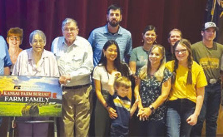 Farm Bureau’s 2023 Farm Family of the year was the Evans family. Accepting the award were Jay Evans, Debbie Evans, Jim Evans, Judy Evans, Jennifer Coberley, Justin Coberley, Andrew Coberley, Anna Coberley, Mike Evans, Hilary Evans, Wiley Evans, Callie Evans and Jace Evans. Courtesy photo.