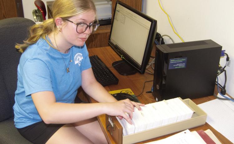 Riverton High School Junior Kaylee Knowlin is working as a volunteer at the Columbus Clione Bieber Genealogical Library of Family History during this summer. She is currently typing the obituary card catalog into the computer so the information will be online in the future.