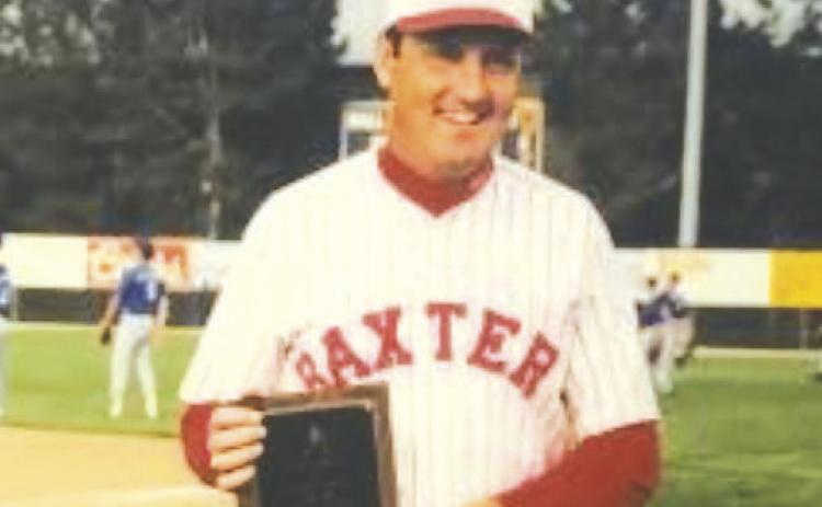 Don Karnes at a state baseball tournament with one of his many awards. Courtesy photo.