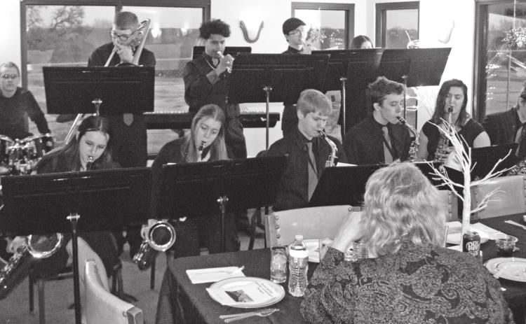 The Baxter Springs High School Jazz Band furnished the entertainment for those attending the Baxter Springs Chamber of Commerce annual meeting. (below) Band Instructor Louis Morgan was leading the musicians before the dinner.