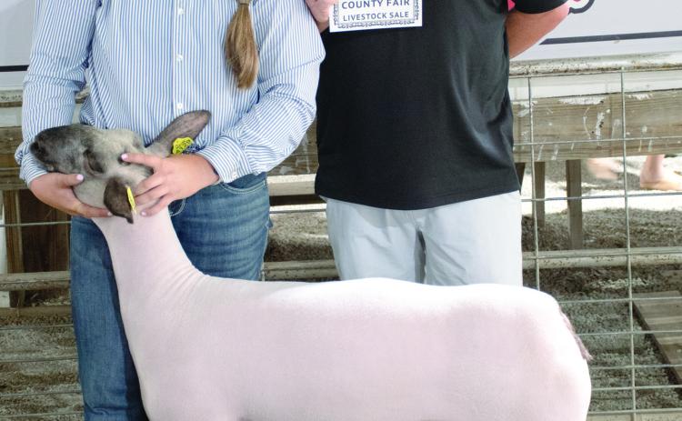 The Grand Champion sheep shown by Kynlee Sommer, Spring Valley Sparklers, was purchased at the premium auction by Jay Hatfield Auto Group represented by Brian Wellmeier.