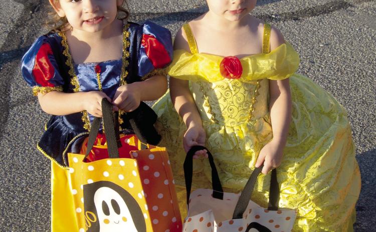 Fletcher and Baker Burns were dressed as Disney© princesses at the Trick or Trunk held Monday night on the Columbus Square.