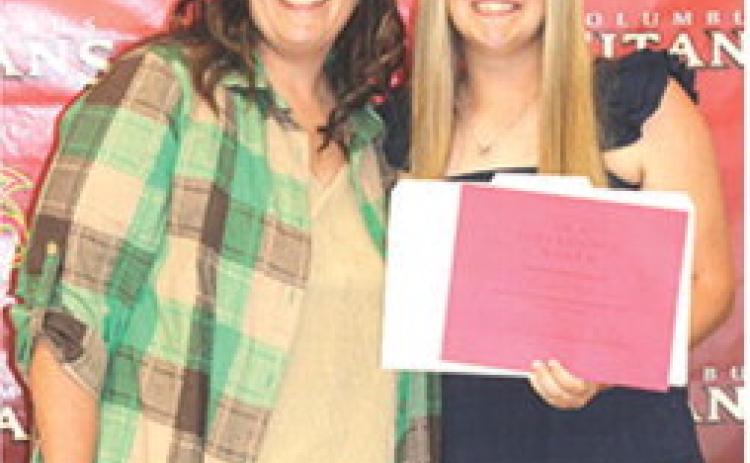 Senior Morgan Richards received the $150 Difference Maker Scholarship from Kerri Matson during the Columbus Unified High School Senior Assembly, in the CUHS Gymnasium, May 15.