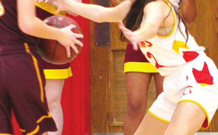 Lady Titan Eighth Grader, Piper Hayes, defends her Girard opponent during the 8A game at the Central Junior High Gym, Monday. The Lady Trojans took a 41-18 win over the hometown Lady Titans.