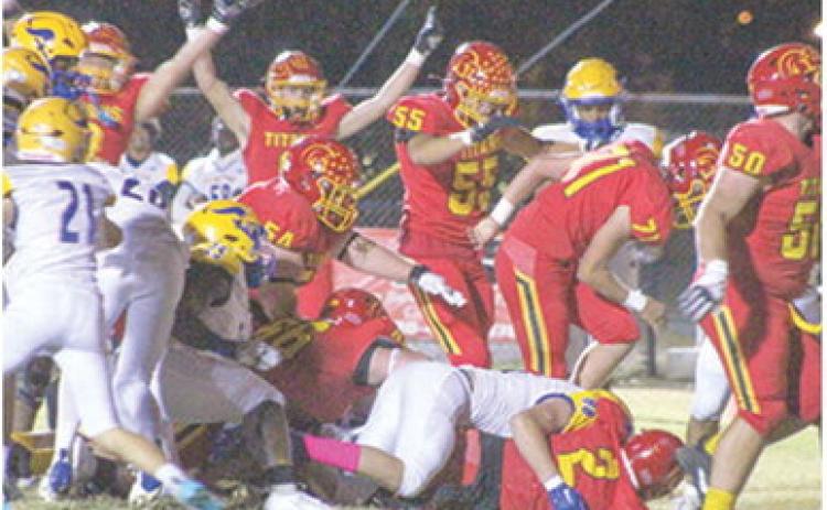 A host of Titans cheer on junior, Jett Tanner as he crossed the goal line from six yards out for the first six points of the 28-21, Columbus win over Parsons, Friday at Titan Stadium.