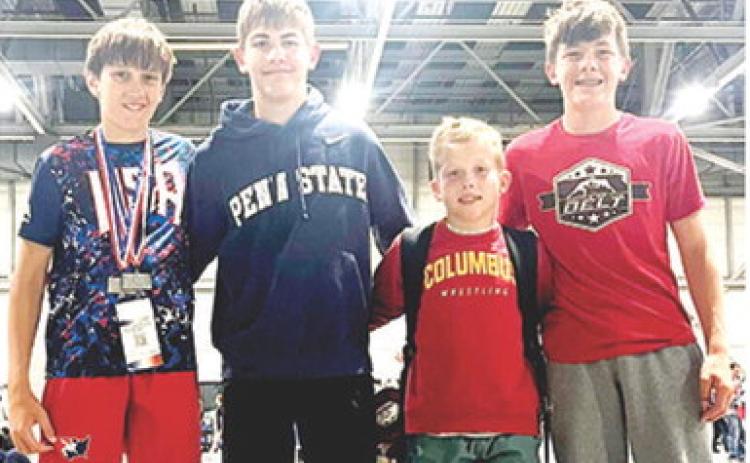 Titan Wrestlers Briggs Johnson, Blaze Bowman, Baylor Bowman, and Cam Carter were part of the Titan Team that participated in the Kansas State Freestyle/ Greco Wrestling in Topeka early in May. They all finished in the top five at the best-of-the-best tournament. Courtesy photo.