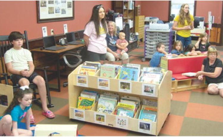 Keeping youngsters busy and connected with the Weir Library through the summer brings out some unusual ideas. Thursday morning the Cherokee County Extension personnel demonstrated the connection between soil and food.
