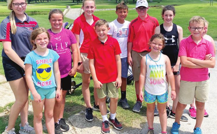 The Columbus Junior Golf Team participated in a tournament, Thursday, in Parsons at the Katy Golf Course. Two Lady Titans and one Titans brought home first place in their respective age divisions. Back row: Reese Grundy, Fallon Smiley, Mallory Thompson, Jayden Rodriguez, Jett Tanner, Natalie Wary and Amory Neely (hidden). Front row: Lyndee Smiley, Tanner Thompson, Alaina Smiley and Cooper Grundy. Courtesy Photo.