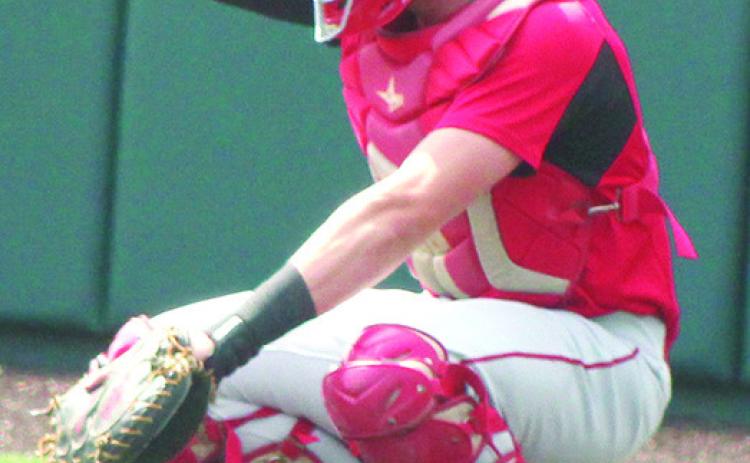 Columbus 2023 Graduate, Landin Midgett, signals his teammates from behind home plate in the Kansas Class 3A State Championship Quarterfinal win over Kansas City-Bishop Ward, May 25, at Kansas State University’s Tointon Family Stadium.