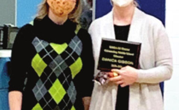 A Southeast music instructor has been named 2020-2021 KMEA Outstanding Music Educator. Danica Gibson teaches at Southeast Middle School and Southeast High School. Her award is for her work at the middle school level. Andrea Dinkel, Southeast District President for KMEA, presented Gibson her award during an assembly at the middle school. Courtesy photo.