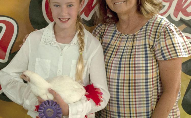 Some 4-H members opt to sell their animals during the premium auction at the Fair. Money received in the premium sale allows them to continue to grow and learn into the next year’s fair, with purchasing their next project animal.