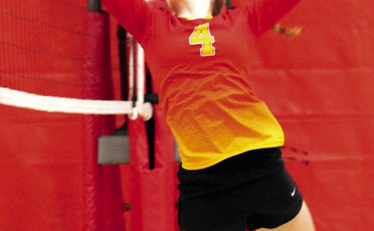 Bentley Townsend tips the ball over the net in the Columbus Eighth Grade Lady Titan win over Baxter Springs, Saturday, in the Columbus Eighth Grade Tournament hosted at the Columbus High School Gymnasium. The Lady Titans had a 25-17 set win over the Lady Lions in pool play and lost the first set, 16-25.